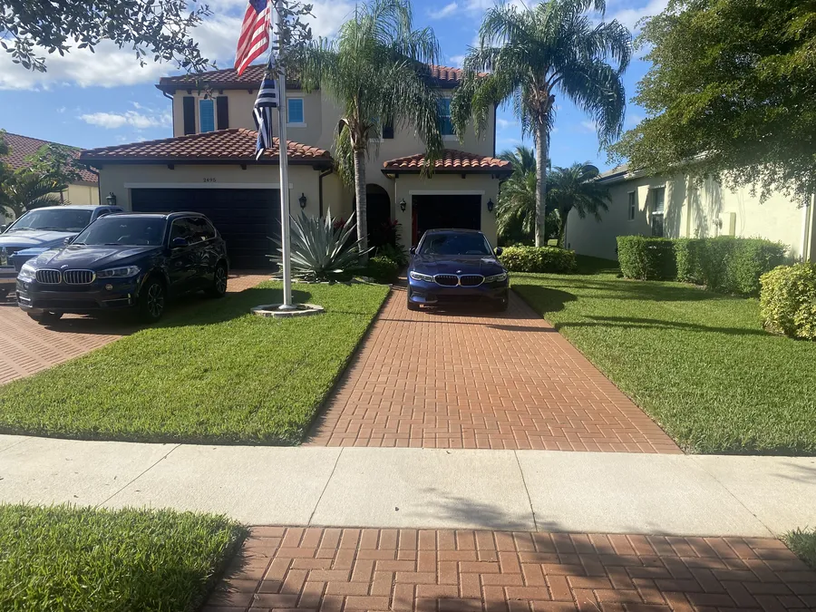 Two-story home with a healthy green front yard